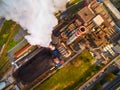 Modern combined heat and power plant with fuming chimney. Royalty Free Stock Photo