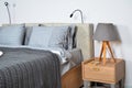 In a modern bedroom bed, pillows and bedside lamps Royalty Free Stock Photo