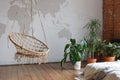 Modern comfortable bedroom interior with green houseplants and a swing, loft furnished. Unusual interior design idea Royalty Free Stock Photo