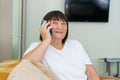 Modern communications. Smiling caucasian elderly woman in casual clothes Royalty Free Stock Photo