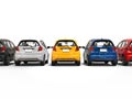 Modern compact electric cars in various colors - back view