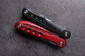 Modern compact portable multitool on grey table, top view Royalty Free Stock Photo