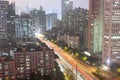modern complex and traffic along on busy road in evening with high-rise building Guangzhou city, China Royalty Free Stock Photo