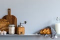 Modern composition on the kitchen interior with vegetables cutting board, food, herbs, kitchen accessories and copy space . Royalty Free Stock Photo