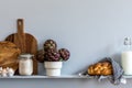 Modern composition on the kitchen interior with vegetables cutting board, food, herbs, kitchen accessories and copy space. Royalty Free Stock Photo