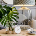 Modern composition of living room interior with design lamp, coffee table, sofa, plant, clock, tropical leaf, notes, mirror. Royalty Free Stock Photo