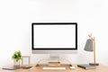 Modern computer with blank screen on desk, space for design. Comfortable workplace Royalty Free Stock Photo