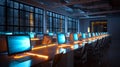 Modern computer lab at night, illuminated by blue screens and neon lighting, creating futuristic look Royalty Free Stock Photo
