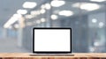 Modern computer,laptop with blank screen on counter barretail store shopand glass wall office Royalty Free Stock Photo