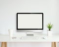 Modern computer monitor template mock up on white work desk Royalty Free Stock Photo