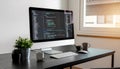 Modern Computer Setup with Code on Screen in Bright Office Royalty Free Stock Photo