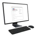 A modern computer setup includes a widescreen monitor displaying a web page Royalty Free Stock Photo