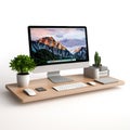 Modern computer setup on a wooden desk with a plant and cactus Royalty Free Stock Photo