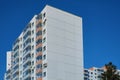 Modern concrete blocks apartment building with a deep blue sky background Royalty Free Stock Photo
