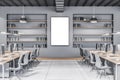 Modern concrete coworking office interior with blank white mock up poster, multiple workplaces and bookcase shelves with books and Royalty Free Stock Photo