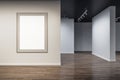 Modern concrete exhibition hall interior with blank white mock up banner on wall and wooden flooring with reflections. Art and Royalty Free Stock Photo