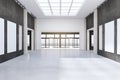 Modern concrete exhibition hall interior with empty posters and sunlight. Gallery concept. Royalty Free Stock Photo