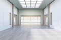 Modern concrete exhibition hall interior with wooden flooring, empty posters and sunlight. Gallery concept. Royalty Free Stock Photo