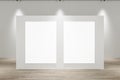 Modern concrete gallery interior with wooden parquet flooring, lights and blank white mock up banner on wall. Exhibition concept. Royalty Free Stock Photo