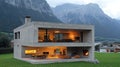 Modern concrete house at twilight with mountain views Royalty Free Stock Photo