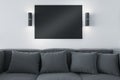Modern concrete living room interior with couch, pillows lights and empty black mock up poster. Design and decor concept 3D Royalty Free Stock Photo
