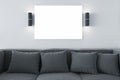 Modern concrete living room interior with couch, pillows lights and empty white mock up poster. Design and decor concept 3D Royalty Free Stock Photo