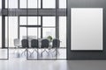 Modern concrete meeting room office interior with empty mock up banner, table, armchairs, window with city view and daylight. Royalty Free Stock Photo