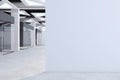 Modern concrete office corridor interior with empty mock up place on wall, glass doors with city view reflections. Workplace Royalty Free Stock Photo