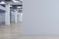 Modern concrete office corridor interior with empty mock up place on wall, wooden flooring, glass doors with city view reflections Royalty Free Stock Photo