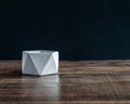 Modern concrete planter on wooden table