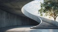 Modern concrete spiral staircase with a tree in the background Royalty Free Stock Photo