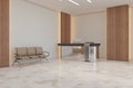 Modern concrete, wooden and marble office lobby interior with shiny reception desk, seat and other objects. Royalty Free Stock Photo