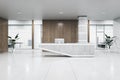 Modern concrete and wooden office interior with reception desk and window with city view. Office lobby and waiting area concept. Royalty Free Stock Photo