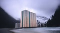 Modern condo building on the seaside in a northern country. Living in harsh climate, in a remote location. Generative AI