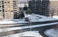 Modern condo buildings with huge windows and balconies and the snow removal tractor in Montreal Royalty Free Stock Photo