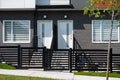 Modern condo entrance. Typical facade of a modern town suburban house in neighborhood of British Columbia