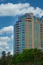 Modern Condo Tower Rising From Trees Royalty Free Stock Photo