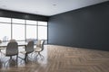 Modern conference room interior with blank mock up place on wall, furniture and panoramic window with city view, daylight and Royalty Free Stock Photo