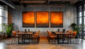 modern office meeting room with orange chairs and abstract orange paintings on concrete walls and large windows Royalty Free Stock Photo