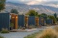 Modern container cabins scenic mountains architectural design outdoor retreat front view unique accommodation experience Royalty Free Stock Photo