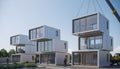 Modern container homes being assembled with cranes under a clear sky, featuring stacked modular units with large glass windows, Royalty Free Stock Photo