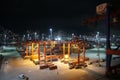 Modern container terminal during night Port of La Guaira observed from cargo ship moored below gantry cranes. Royalty Free Stock Photo