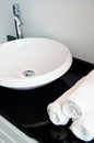 Modern and contemporary bathroom detail in a luxury home, white sink and tap Royalty Free Stock Photo