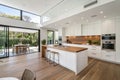 Modern Contemporary Kitchen with White and Wood Materials Royalty Free Stock Photo