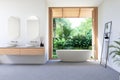 Modern contemporary loft style bathroom with tropical garden view 3d render Royalty Free Stock Photo