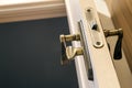 Modern, contemporary satin wooden door metal handle close-up detail Royalty Free Stock Photo