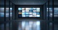 Modern control room with large video wall displaying multiple digital screens in a sleek, reflective, high-tech environment Royalty Free Stock Photo