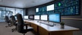 Modern control room with multiple computer monitors displaying technical data and diagrams in a clean, organized workspace with Royalty Free Stock Photo