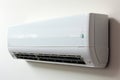 Modern cooling Split AC on white wall, surrounded by a subtle blur Royalty Free Stock Photo