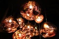 Tom Dixon glass pendant light installation hanging in attic with wooden beams